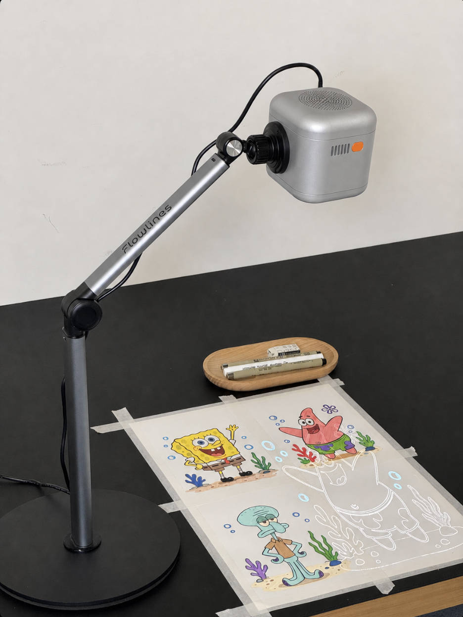 Flowlines projector guiding a drawing on a desk